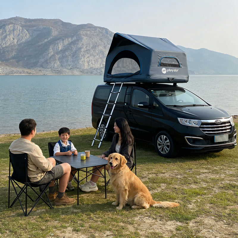 PlayDo Castle inflatable rooftop tent on black MPV vehicle, family with golden retriever relaxing at lakeside mountain campsite